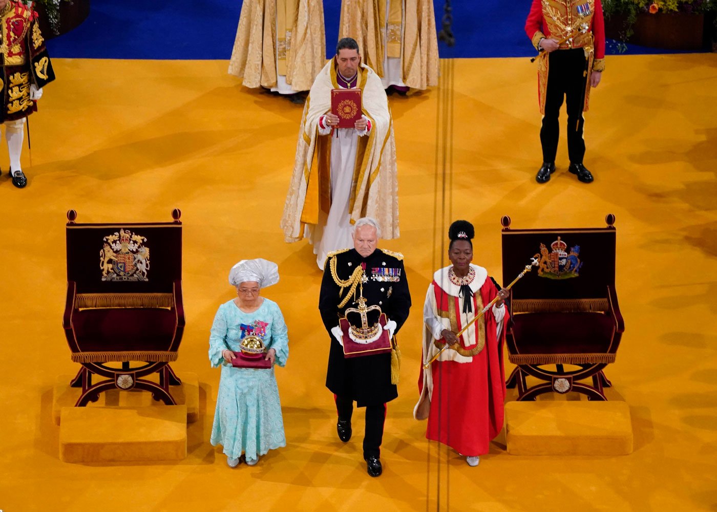 The Orb, the Sceptre with Dove and the Imperial State Crown are brought to the thrones