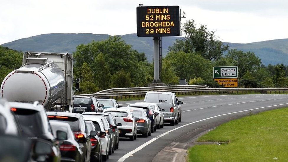 Cars on motorway approaching the border between Northern Ireland and Ireland