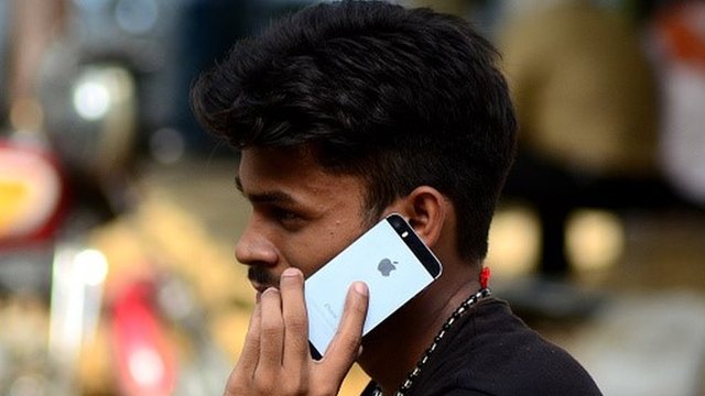 Man in India on mobile phone