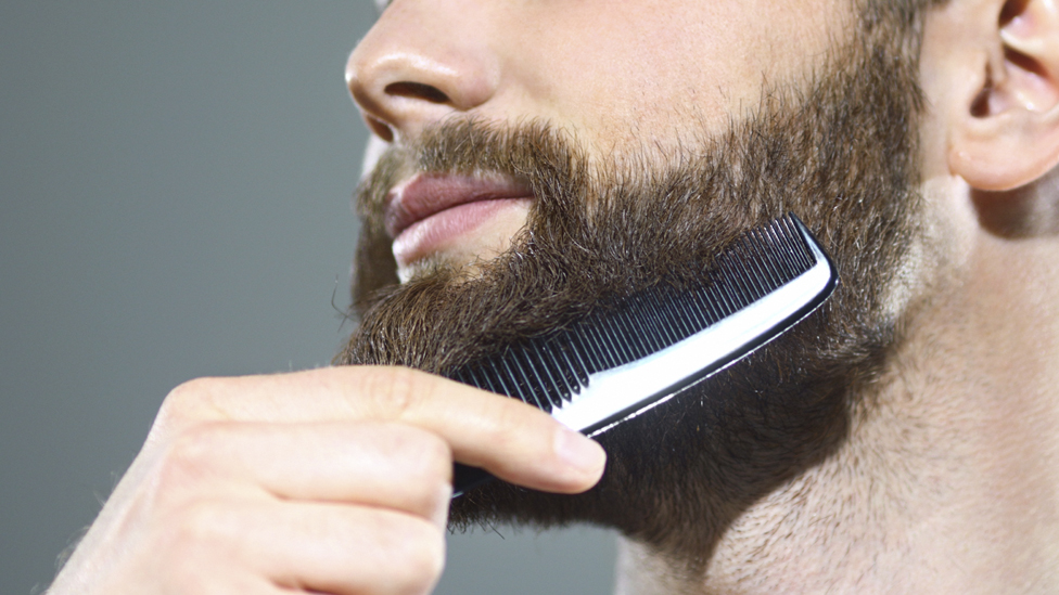 Man combing a beard