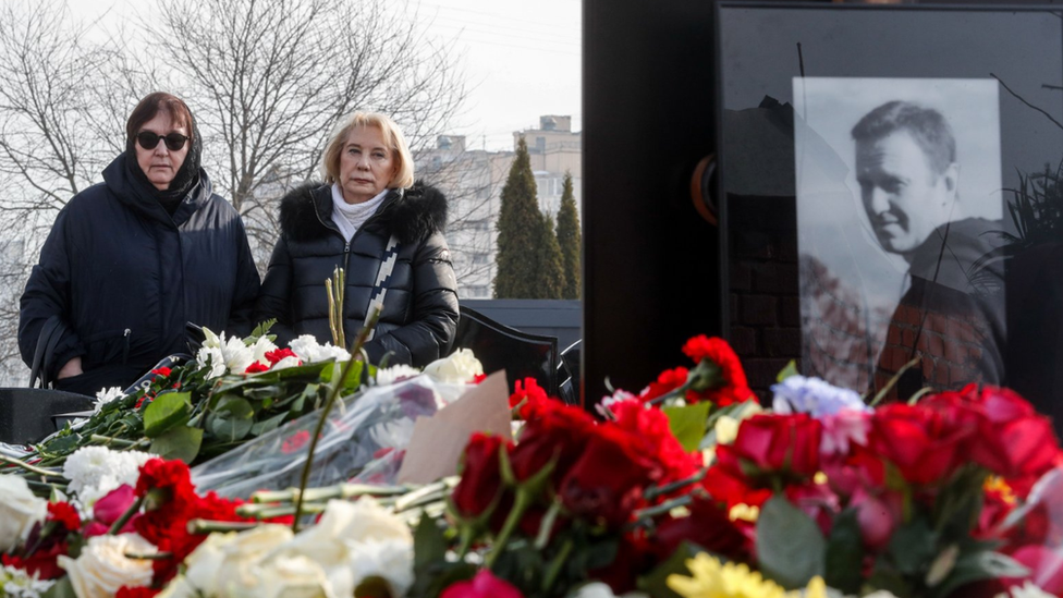 Lyudmila Navalnaya, mother of late Russian opposition leader Alexei Navalny, mourns near her son's grave at the Borisovskoye cemetery, on the outskirts of Moscow