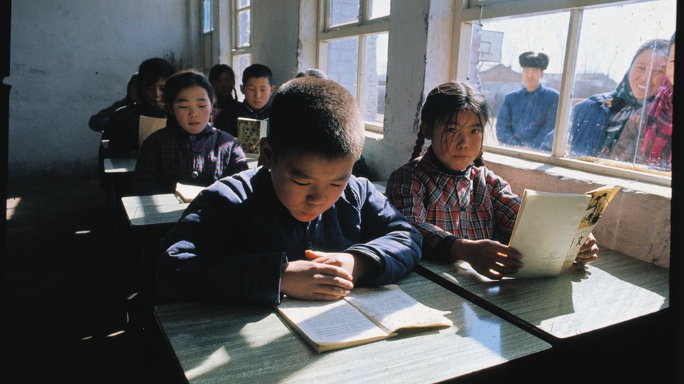 General view of children attending class in a Peking school during the time of President Nixon's visit to China.