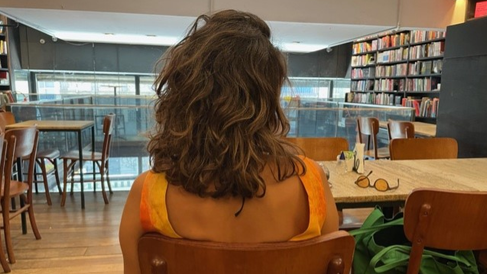 A photo of a woman from the back