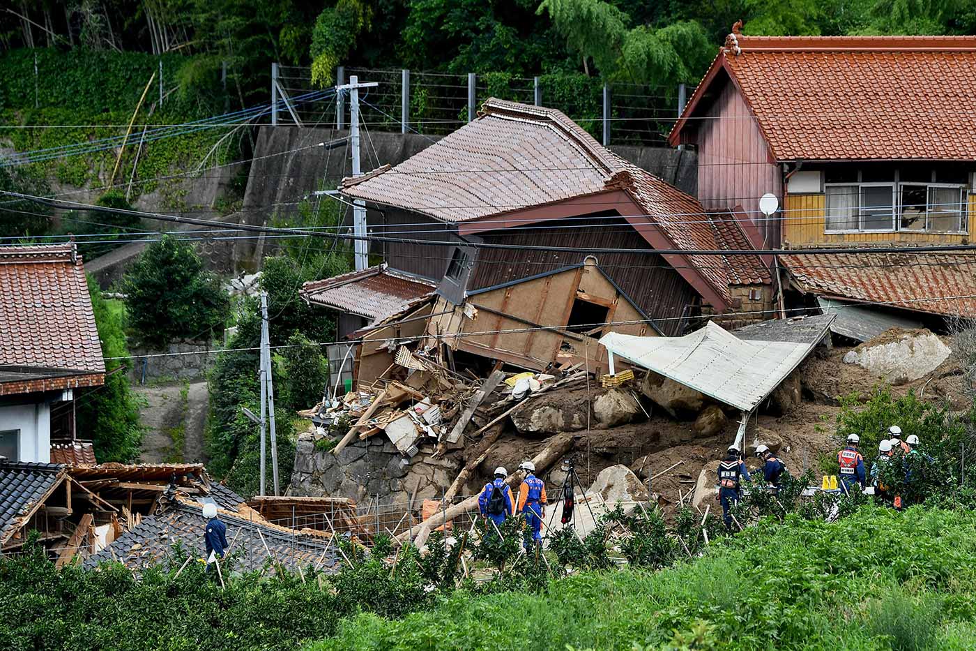 Rescue teams at the site of a landslide caused by heavy rains in Karatsu City, Saga prefecture - 11 July 2023