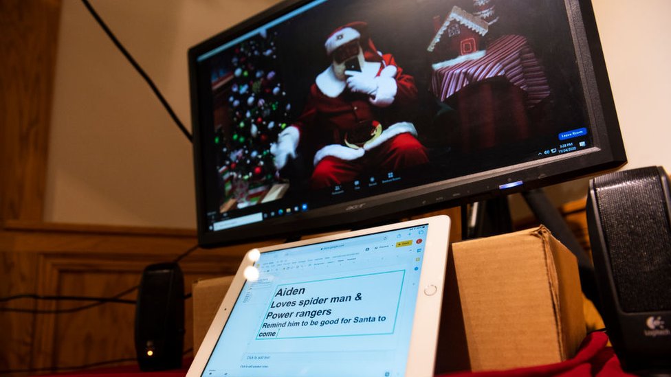 Santa consults an iPad when talking to children online