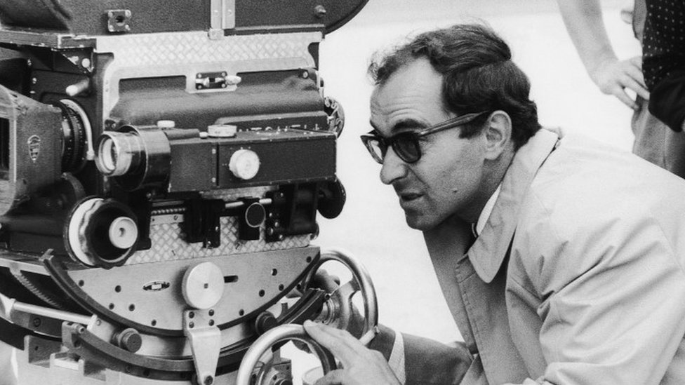 Film director Jean-Luc Godard on the set of Pierrot le Fou