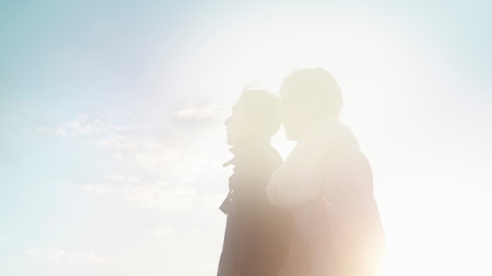 Silhouette of a couple on a sunny day