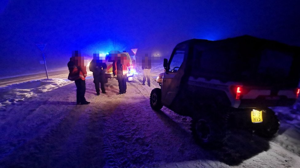 Motorists being rescued in the snow