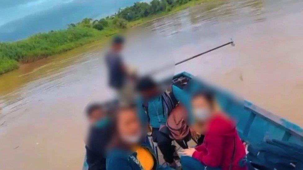 An image of crossing a river with a victim rescued by Thai authorities.