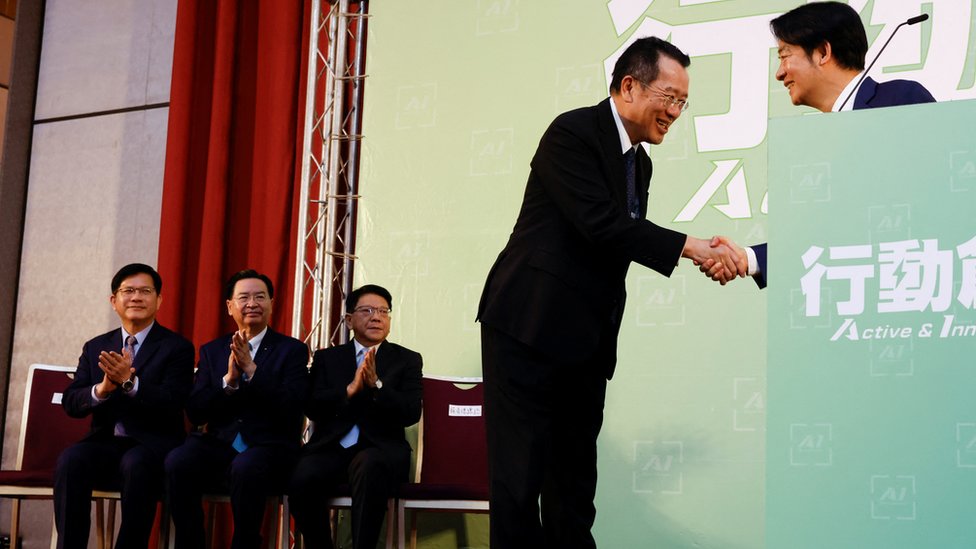 Taiwan President-elect Lai Ching-te and Incoming Defence Minister Wellington Koo, shake hands during a press conference, in Taipei