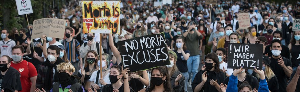 Protesters march during a demonstration for the evacuation of all migrant camps in Greece