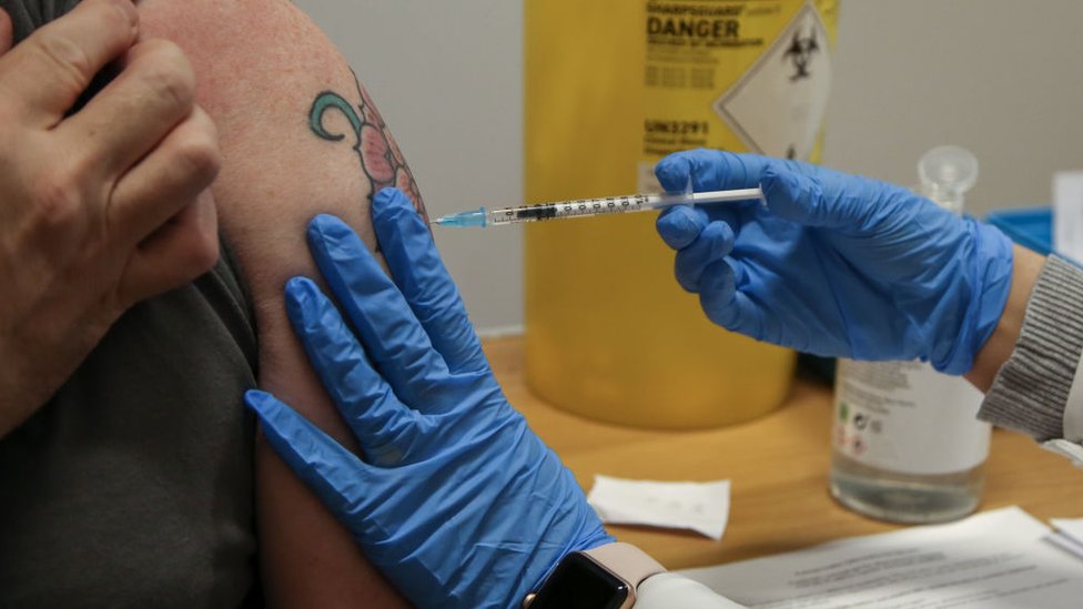 A woman being vaccinated with a booster jab in November in the UK