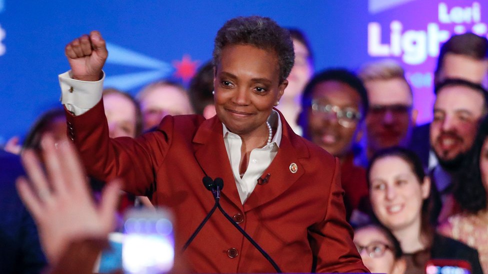 Lori Lightfoot celebrates victory with fist in the air