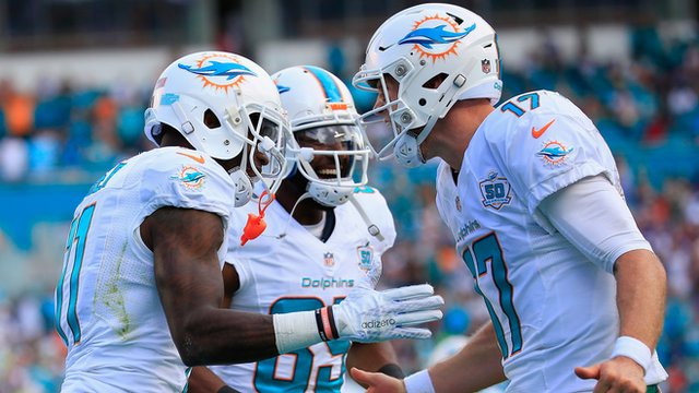 DeVante Parker celebrates with his team-mates after scoring a try for the Miami Dolphins