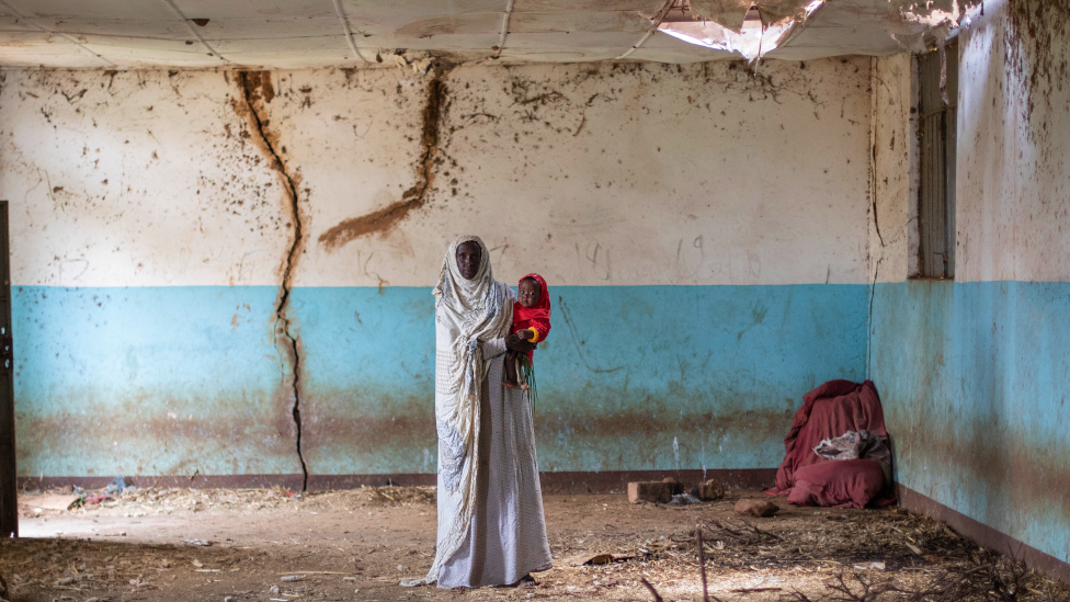 Sahra and her granddaughter in an old building at the site of Hartisheik refugee camp in Ethiopia