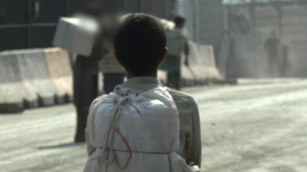 The Afghan children hiding under moving lorries