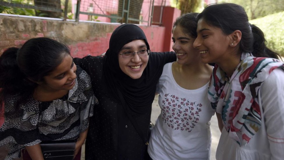 A Muslim mother with her daughter and her friends celebrates at St. Thomas School after the class 10th CBSE result announced, on June 3, 2016 in New Delhi, India.