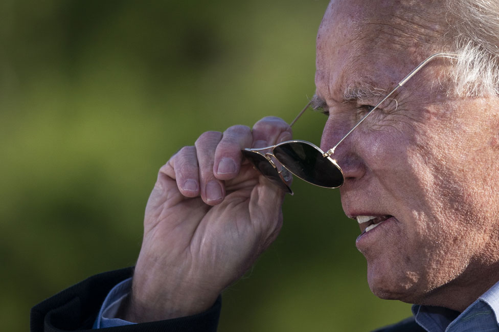 Joe Biden takes off his sunglasses