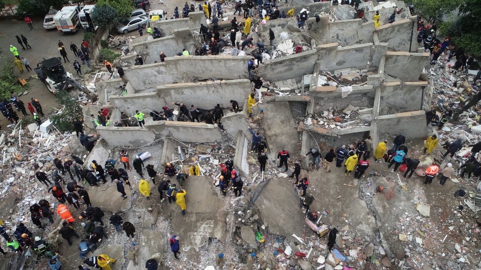 An aerial view shows search and rescue operation carried out at the debris of a building in Cukurova district of Adana