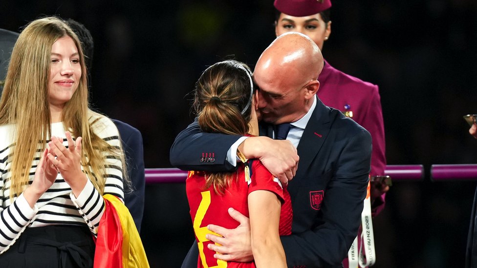 Rubiales kisses Aitana Bonmatí afrter Spain's World Cup win, while the Spanish Queen's daughter Infanta Sofía looks on