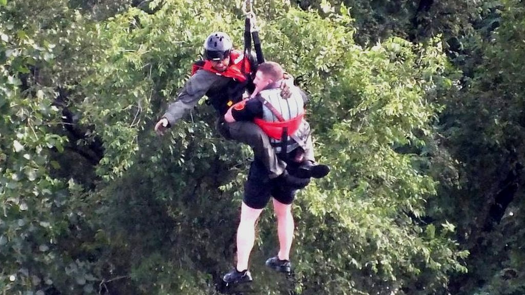 New Jersey: Dramatic rescue as helicopter pulls firefighter from dam