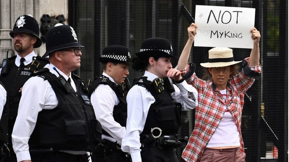 An anti-Royal demonstrator protests outside Palace of Westminster, central London, on12 September