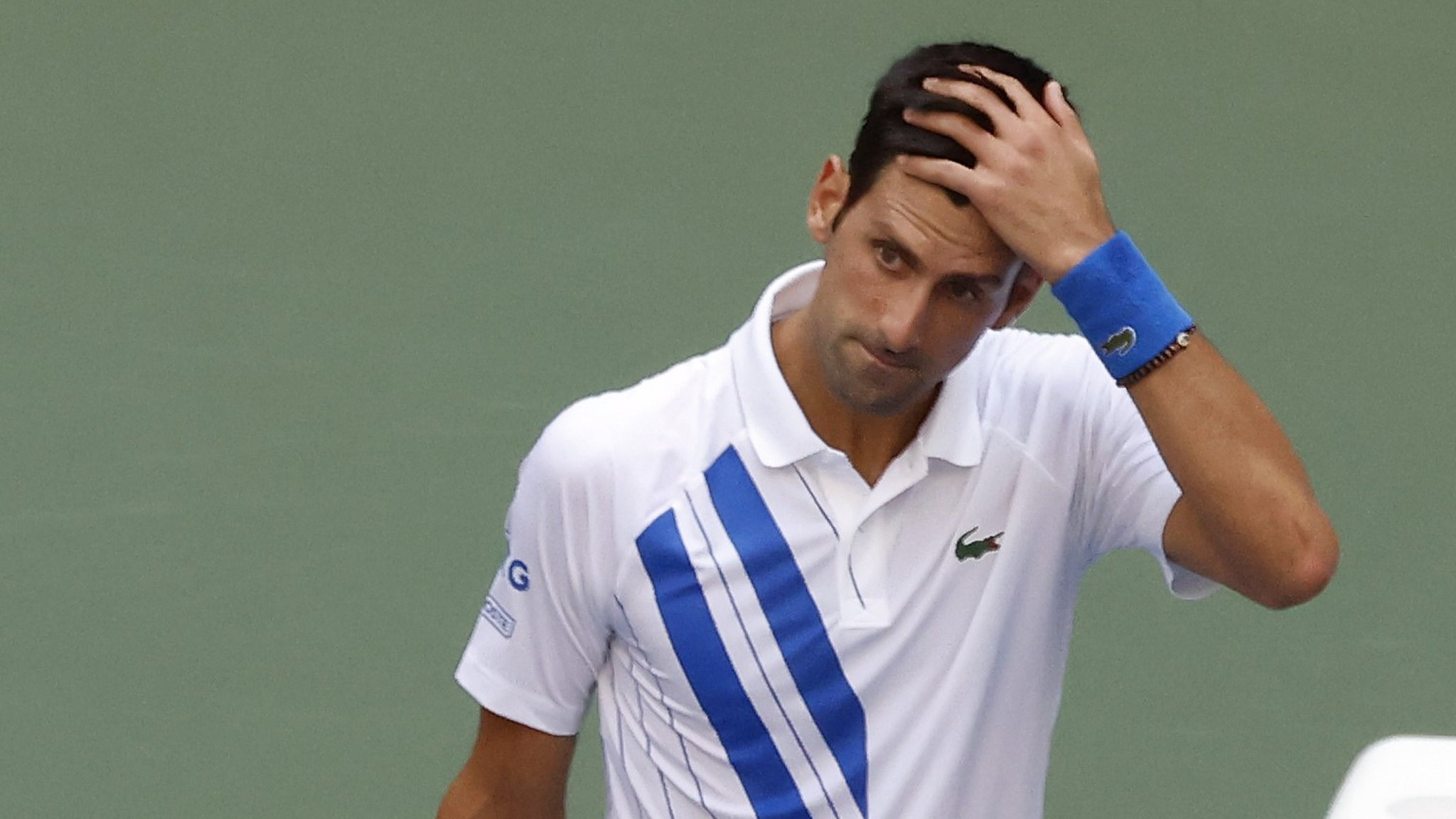 Novak Djokovic apologises after hitting line judge with ball at US Open