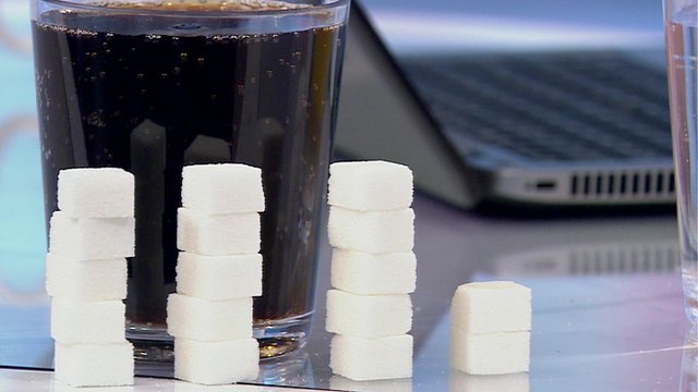 Sugar cubes next to drink
