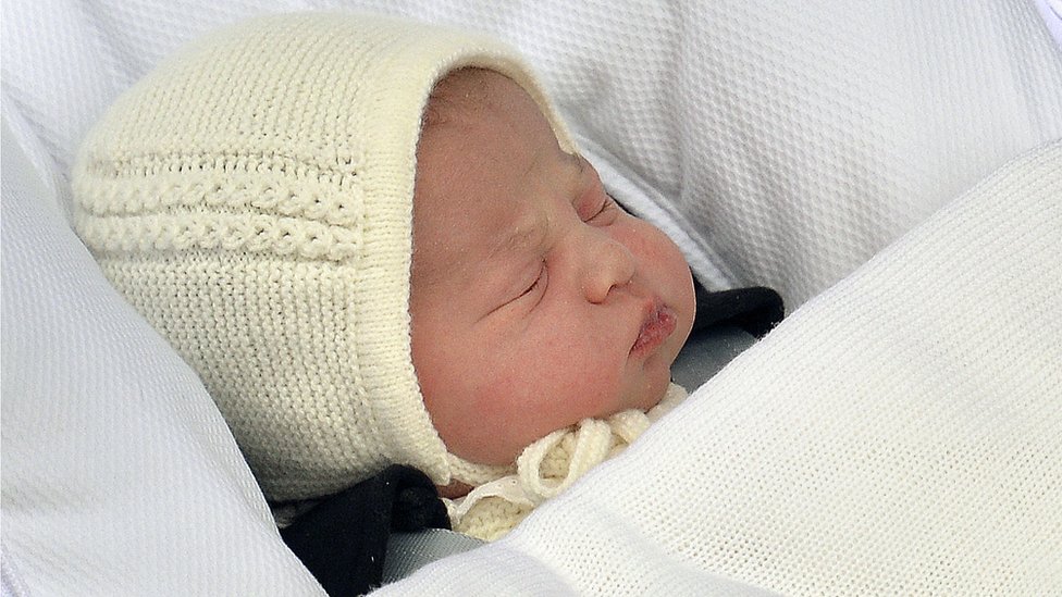 The newborn baby princess, born to parents Kate Duchess of Cambridge and Prince William, is carried in a car seat by her father from The Lindo Wing of St. Mary's Hospital, in London, Saturday, 2 May 2015.