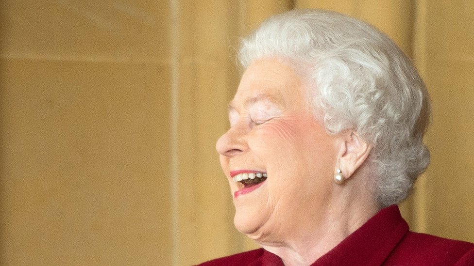 Queen laughing
