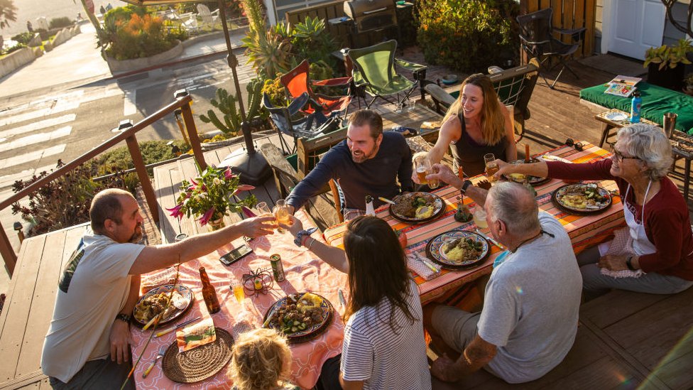 The Liggett family dine outside in Manhattan Beach, California, on 26 November 2020