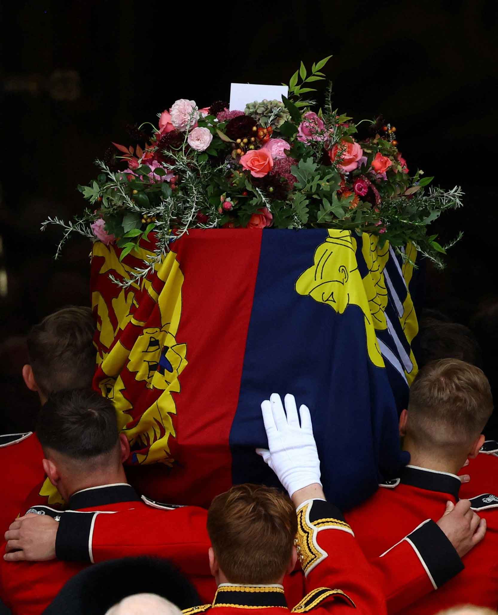 The Queen's coffin passes under the arch of the Great West Door.