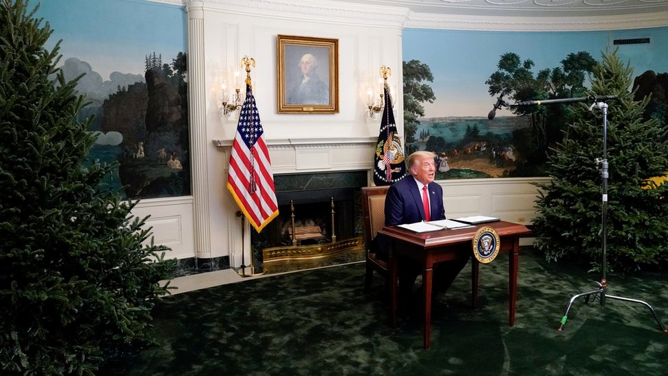 US President Donald Trump participates in a Thanksgiving video teleconference with members of the military forces at the White House in Washington, 26 November 2020