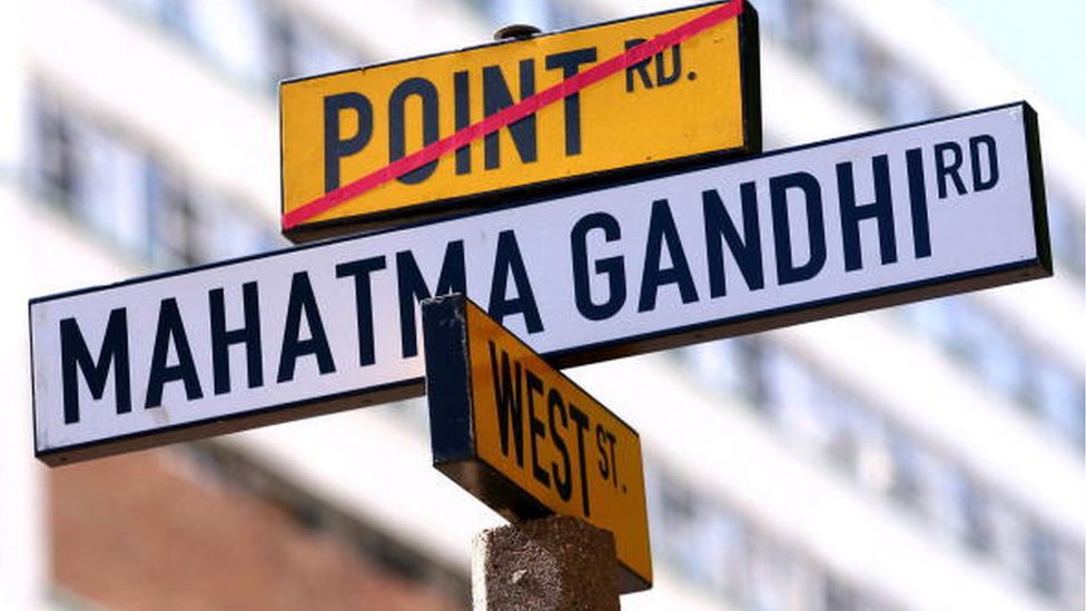 South African seaside city grapples with name changes A street sign on the old 'Point Road and West Street' is replaced by the new 'Mahatma Gandhi Road' in central Durban 06 May 2007.