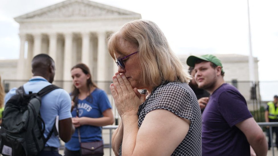 A pro-life supporter reacts outside the US Supreme Court in Washington, DC