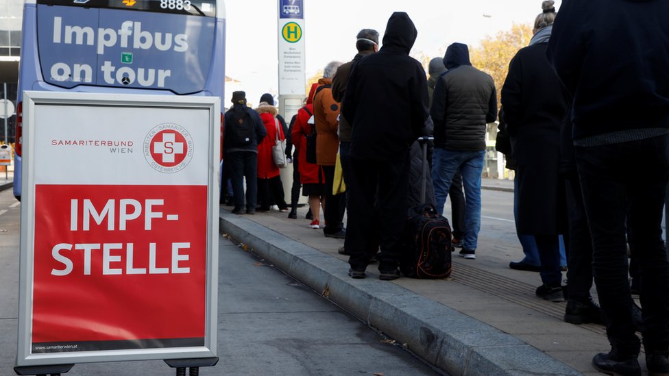 People wait in front of a vaccination bus during the coronavirus disease (COVID-19) outbreak in Vienna