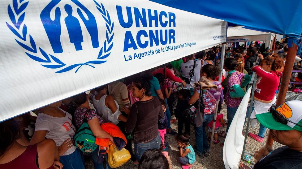 Венесуэльские мигранты подают заявление о предоставлении статуса беженца на границе с Перу 14 июня 2019 г.