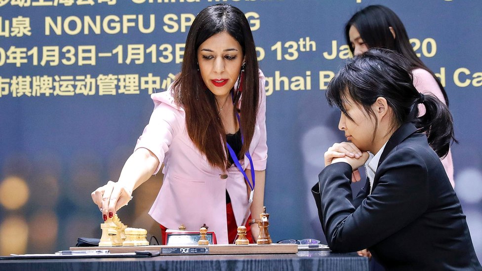 Shohreh Bayat (L) prepares for a match at the 2020 International Chess Federation (FIDE) Women's World Chess Championship in Shanghai, 11 January 2020