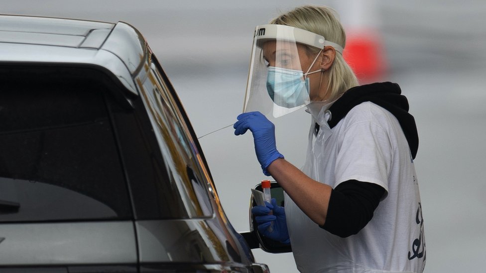 A coronavirus test being given at a drive-through centre in Leicester