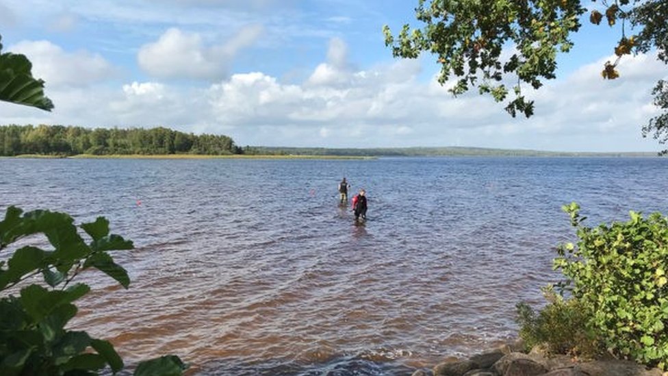 Excavators search for items at the Vidöstern lake in Jönköping County, Sweden