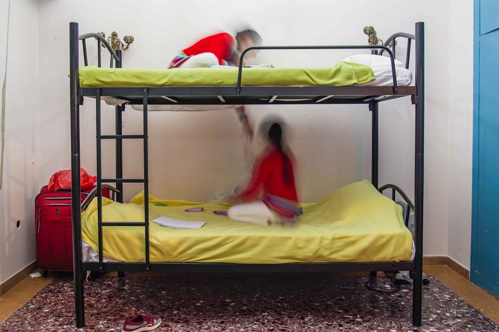 The temporary apartments in Greece were simple, kitted out with bunk beds, a table and chairs.