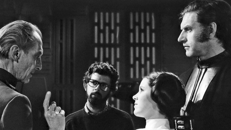 Peter Cushing, George Lucas, Carrie Fisher and Dave Prowse on the Star Wars set