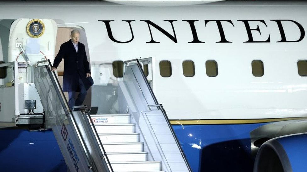 US President Joe Biden disembarks from Air Force One as he arrives at Chopin Airport in Warsaw, Poland, 20 February 2023