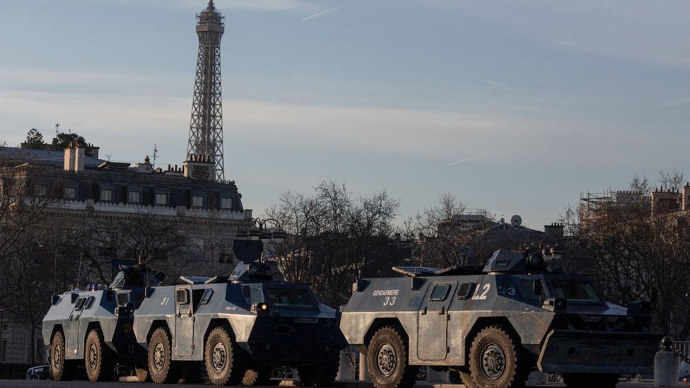 Armoured police vehicles by the Arc de Triomphe in Paris wait for anti-Covid demonstrations, 12 February 2022