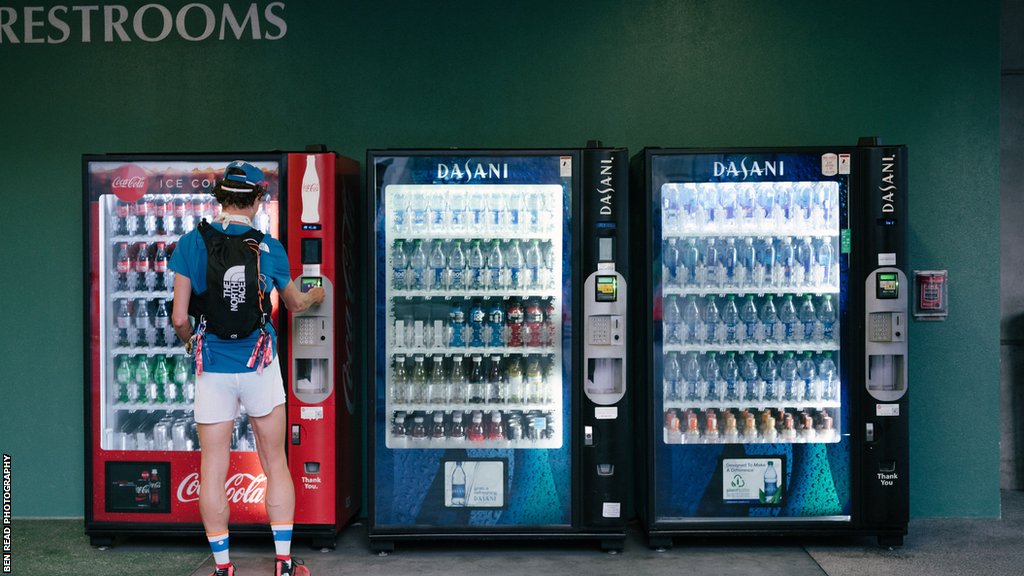 James Poole buys drinks from a vending machine during TSP 2022