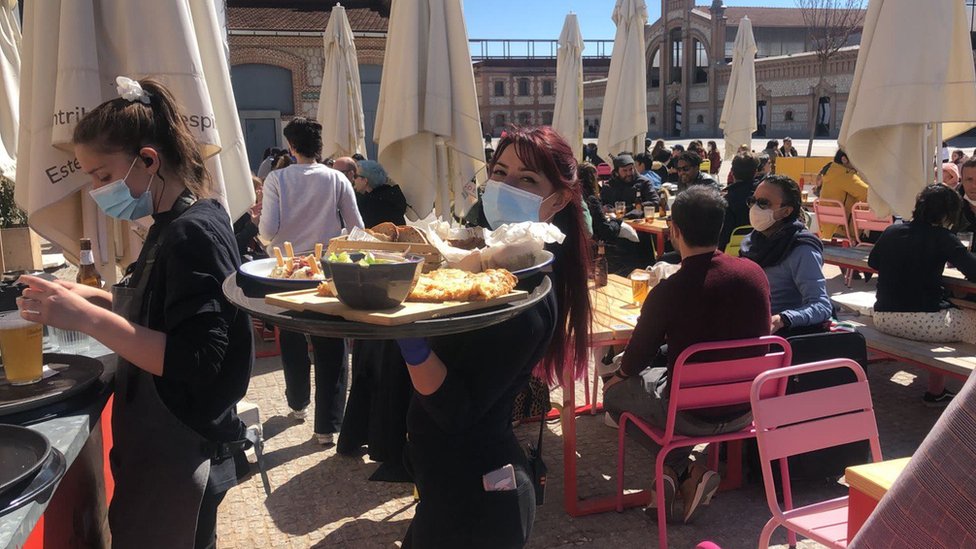 Tables at La Francachela's restaurant are on the patio, with staff turning