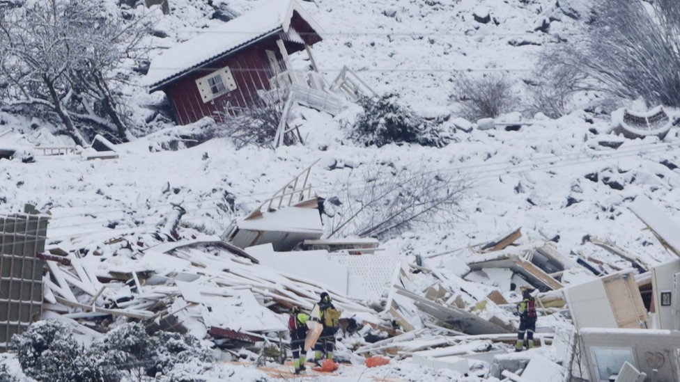 Rescue crews are working in the landslide area where a large landslide occurred at Ask in Gjerdrum municipality, Norway, 01 January 2021.