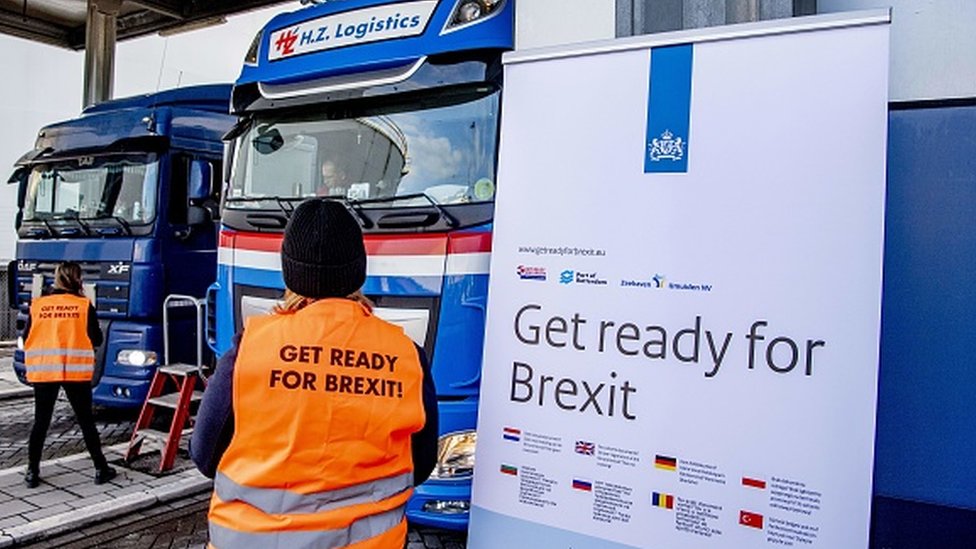 Flyers are distributed, as part of the Get Ready For Brexit campaign, to truck drivers at the terminal of a ferry operator in the port of Rotterdam
