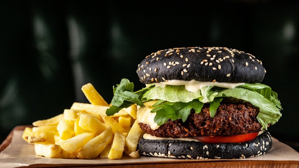 Vegan burger in a black bun