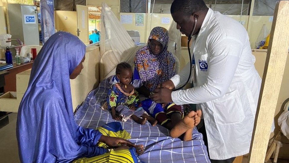 Dr. Japhet Udokwu attends to a child at a treatment center for severely malnourished children in Damaturu, Yobe, Nigeria August 24, 2022